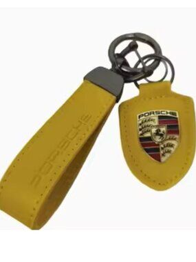 Porsche Yellow and Gold Keychain Pendant Yellow Leather Raised Metal Logo. NWT